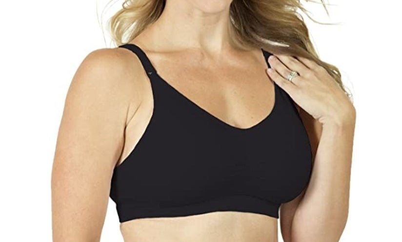 A model shows off a black combination pumping and nursing bra 