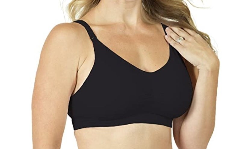A model shows off a black combination pumping and nursing bra 