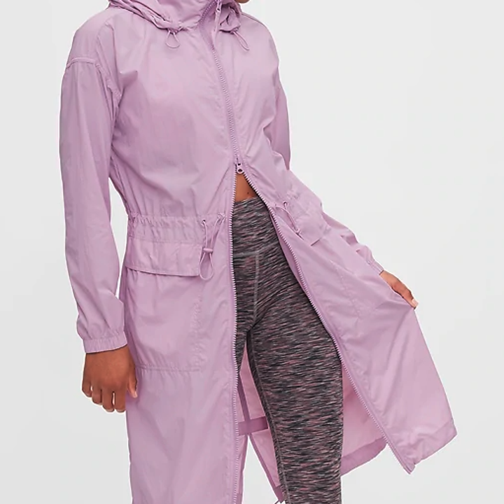 The model wears the same jacket in lavender