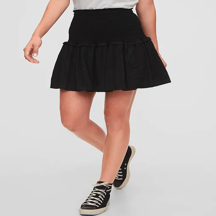 A model wears the mini skirt in black