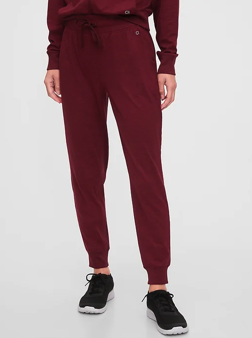 Model wearing the joggers, the hem just hits the ankle