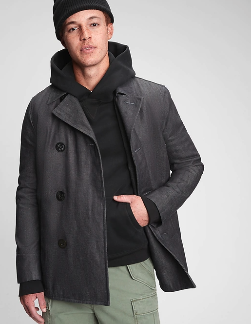 A male model wearing the dark grey denim peacoat