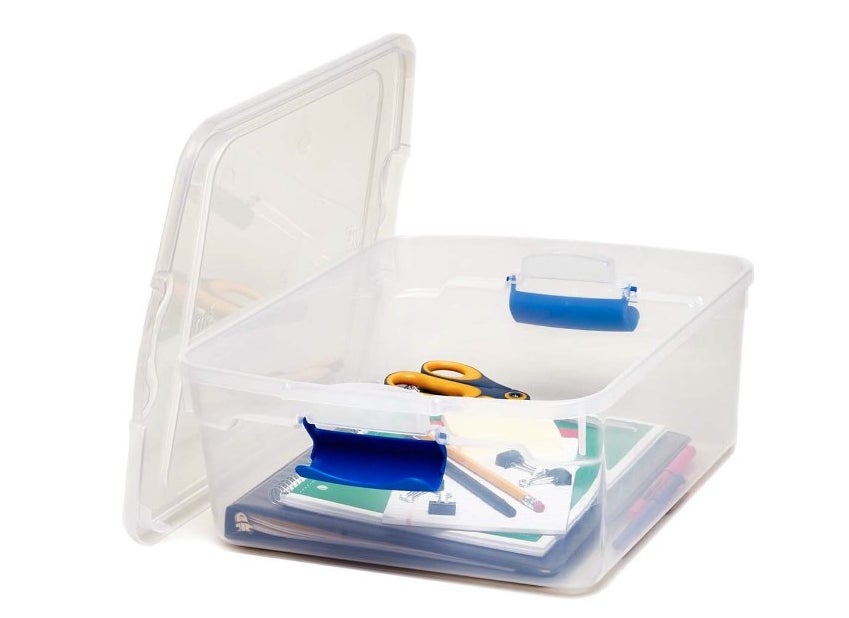 The storage bin being used to hold school supplies