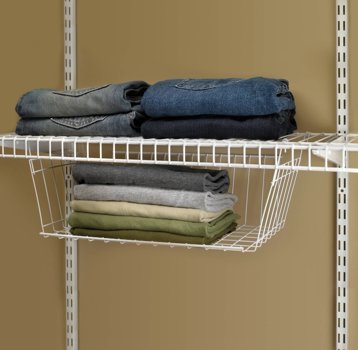 The white hanging basket being used to hold jeans and scarves