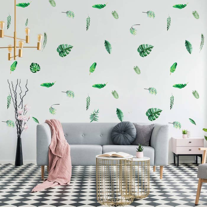 Leaf stickers covering a wall in sporadic locations