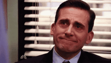gif of michael scott from the office grinning and tearing up