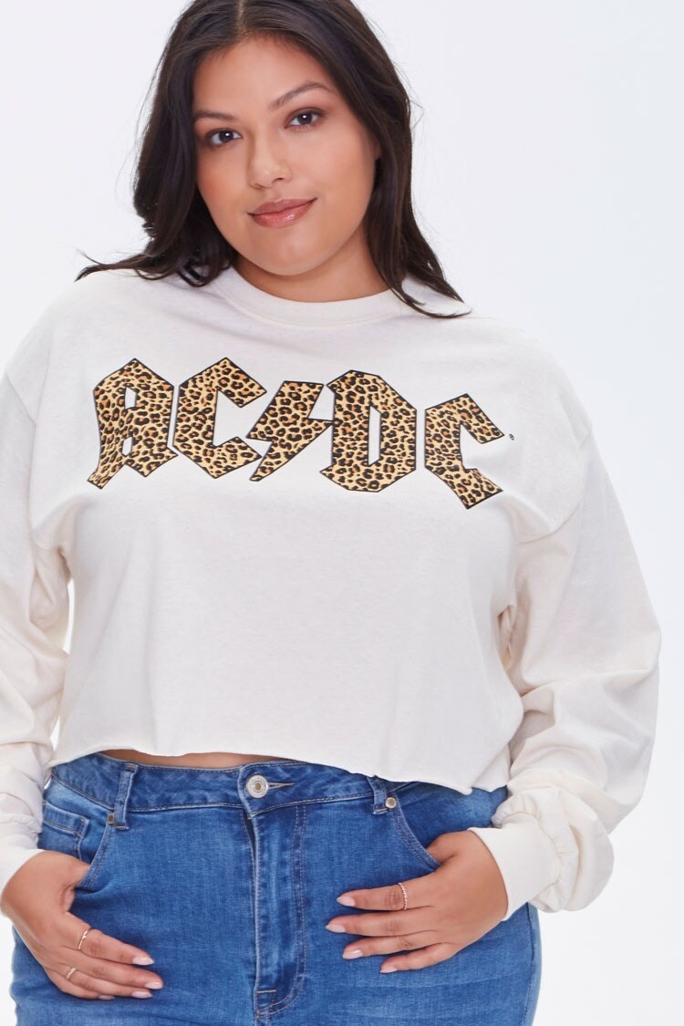 model wearing cream cropped sweater with leopard print ACDC logo