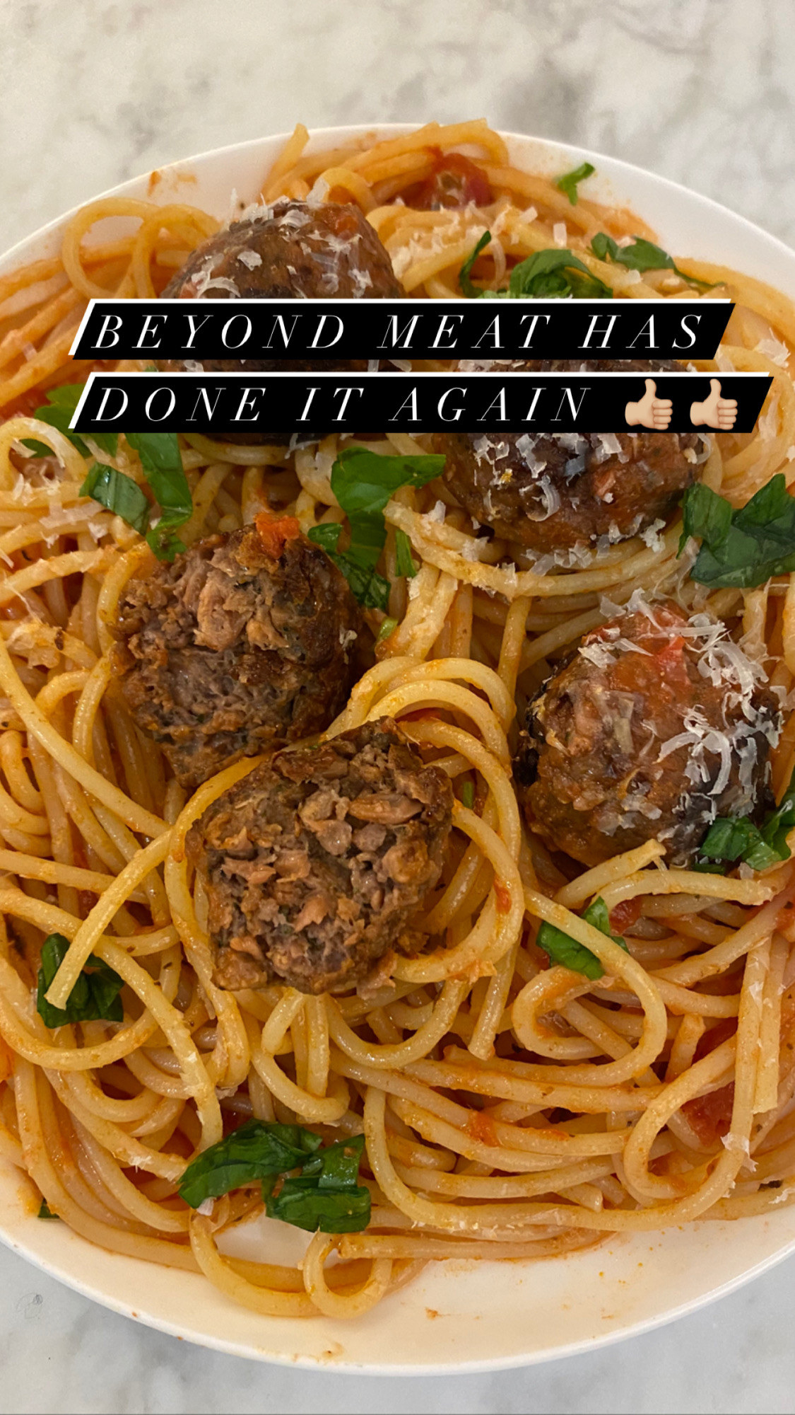 A plate of Beyond Meat meatballs over spaghetti. 