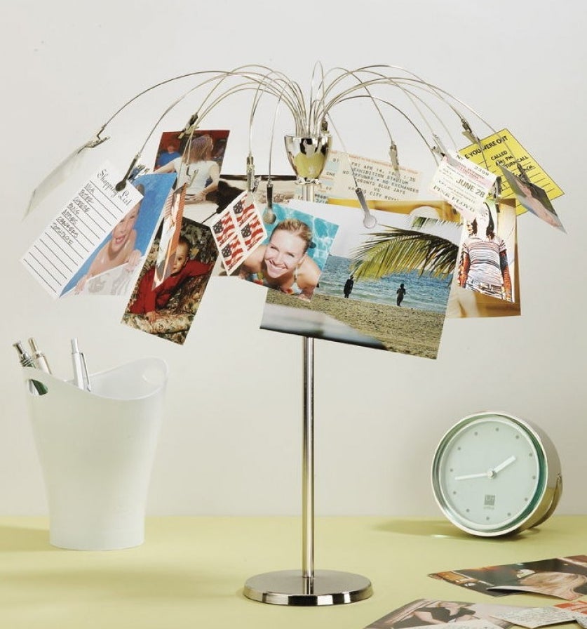  plated stainless steel picture holder with an umbrella shape that has clips to hold photos