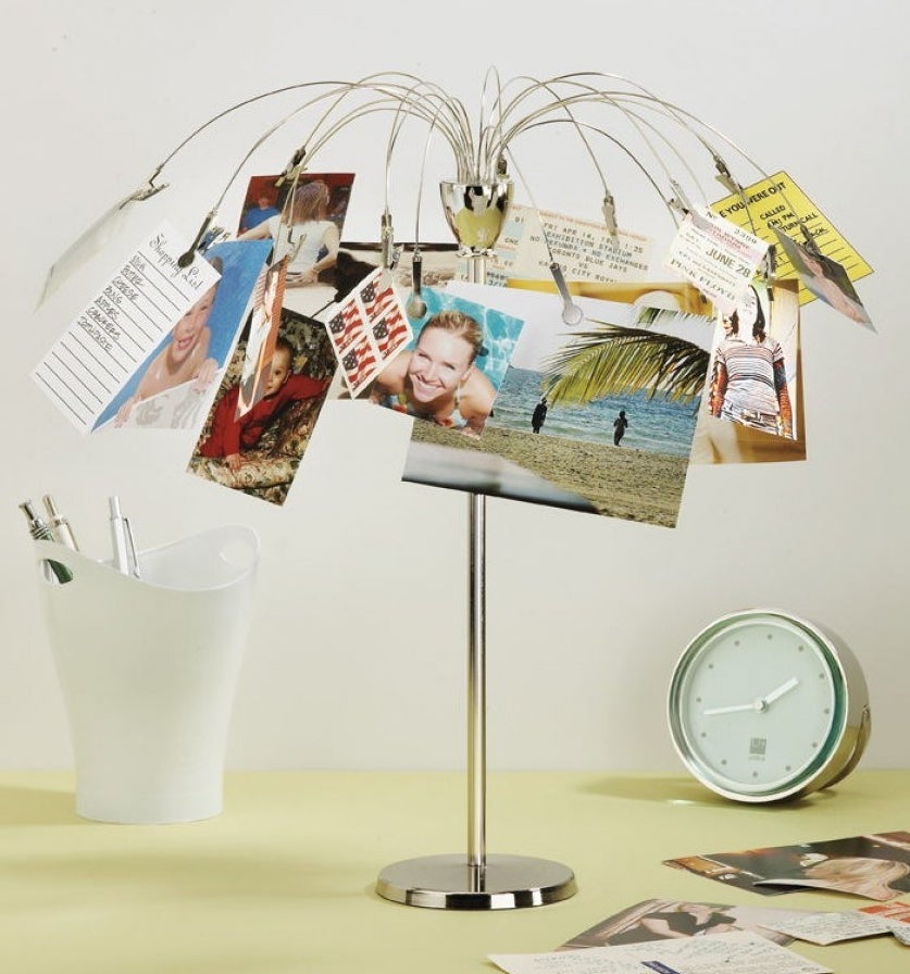 plated stainless steel picture holder with an umbrella shape that has clips to hold photos