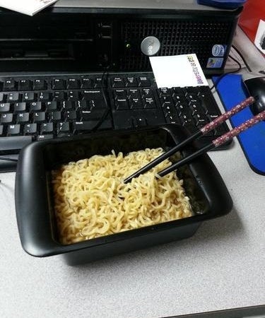 A reviewer&#x27;s cooked noodles in the black square cooker bowl