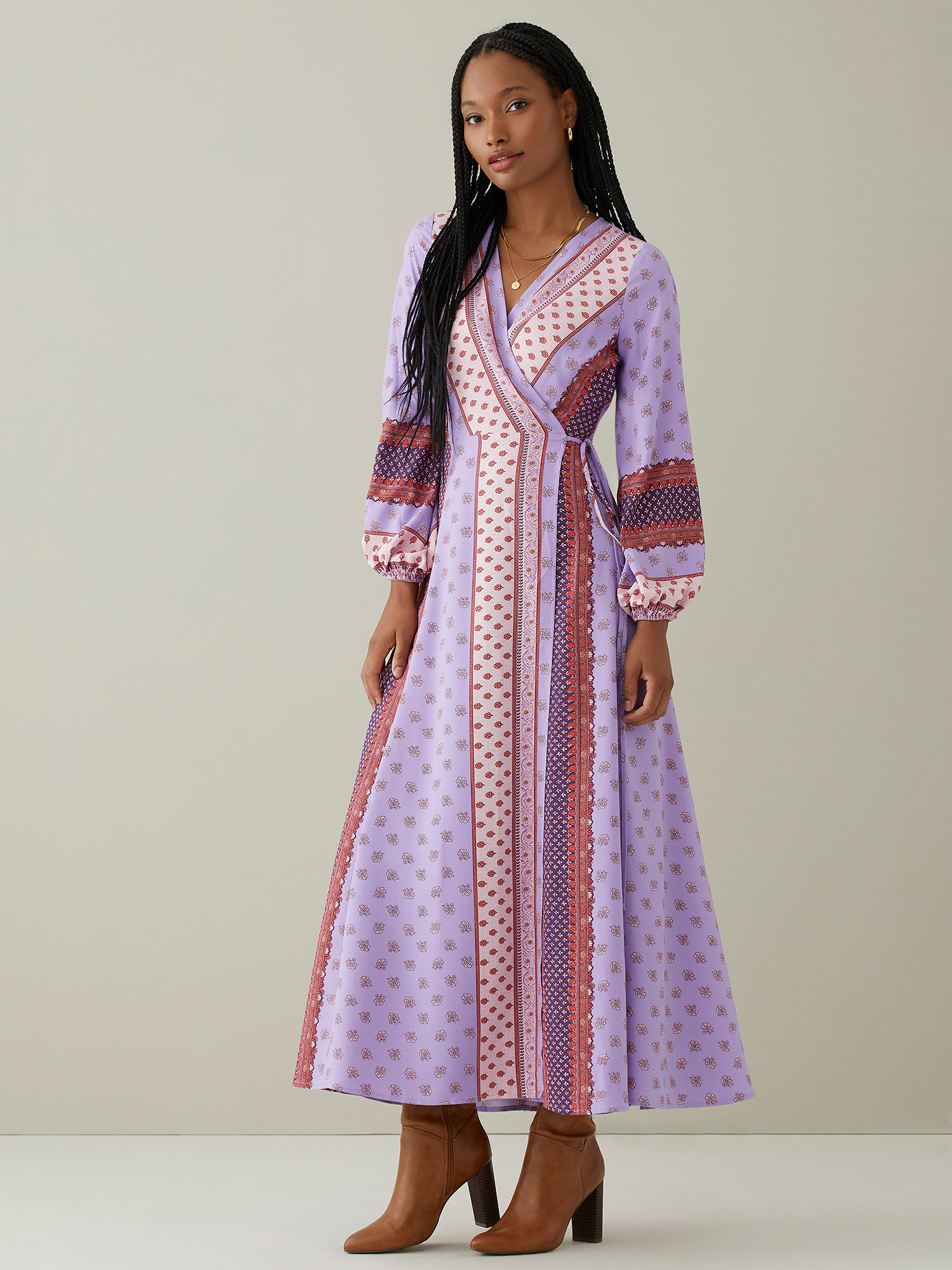 Model wears the lavender printed dress