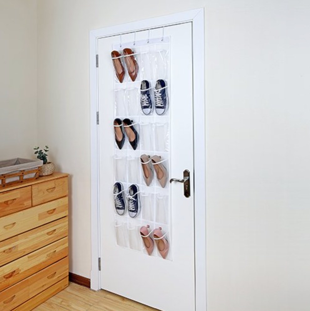 The over-the-door shoe holder being used to hold sneakers and heels