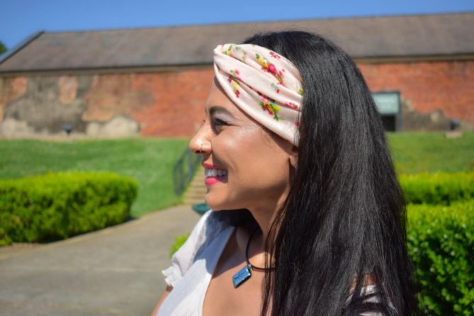 a reviewer wearing a floral pastel headband 