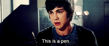 Percy gesturing with a ballpoint pen and saying, &quot;This is a pen&quot;