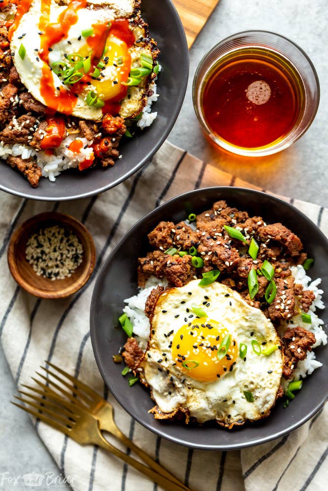 A Korean ground beef bowl topped with a fried egg and scallions.