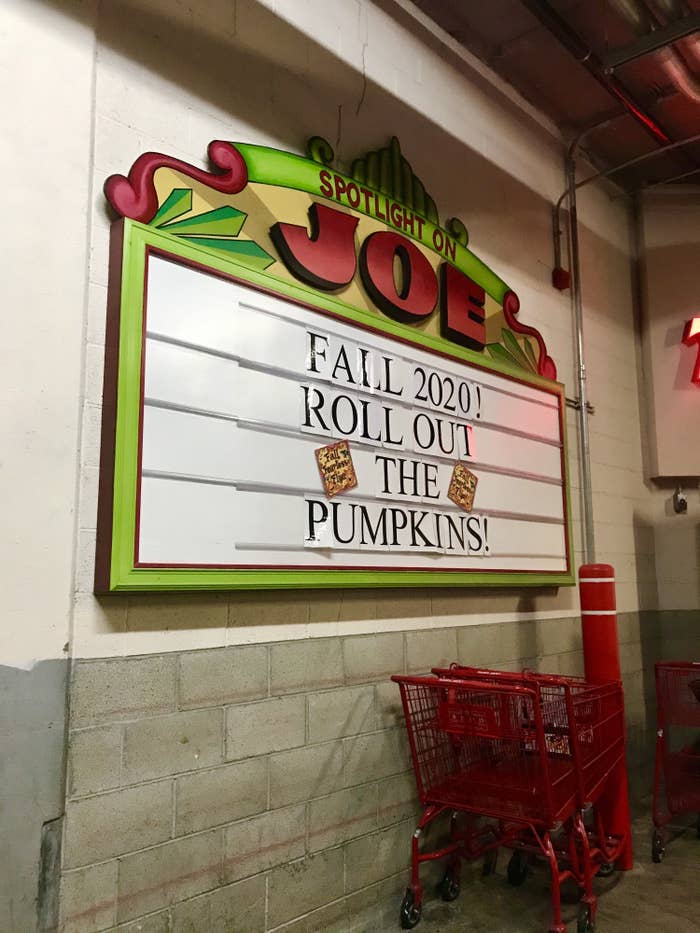 A sign outside of Trader Joe&#x27;s that says &quot;Fall 2020! Roll out the pumpkins!&quot;