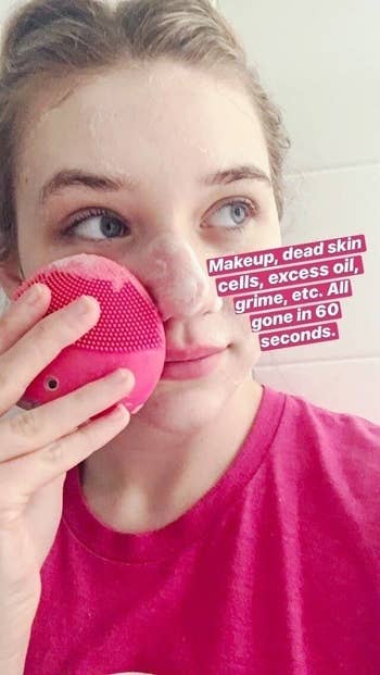 BuzzFeed Editor Maitland Quitmeyer using the pink cleansing brush to cleanse her face