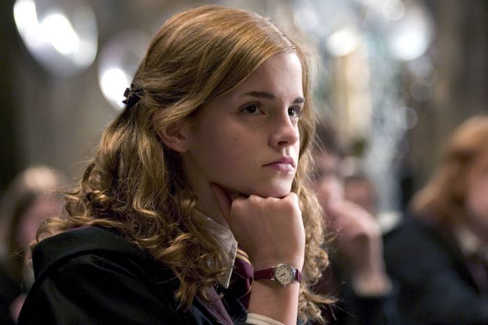 Hermione leaning her head onto her hand