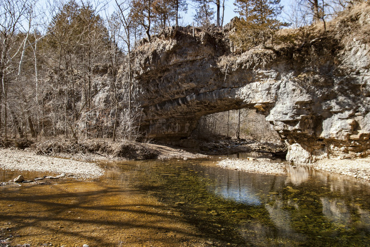 Natural bridge crosses Clifty Creek in the backwoods of Missouri