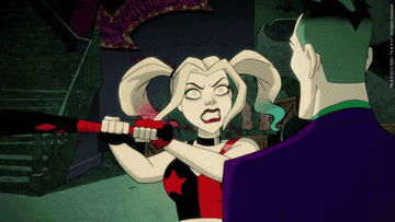 Harley Quinn hitting the joker in the face