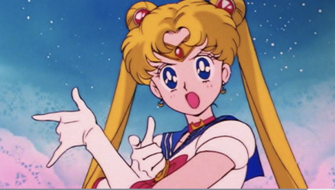 Sailor Moon talking with her hands up 