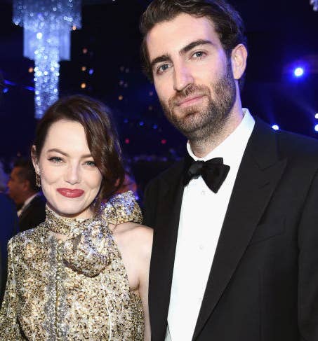 Emma and Dave posing for a photo at an award show