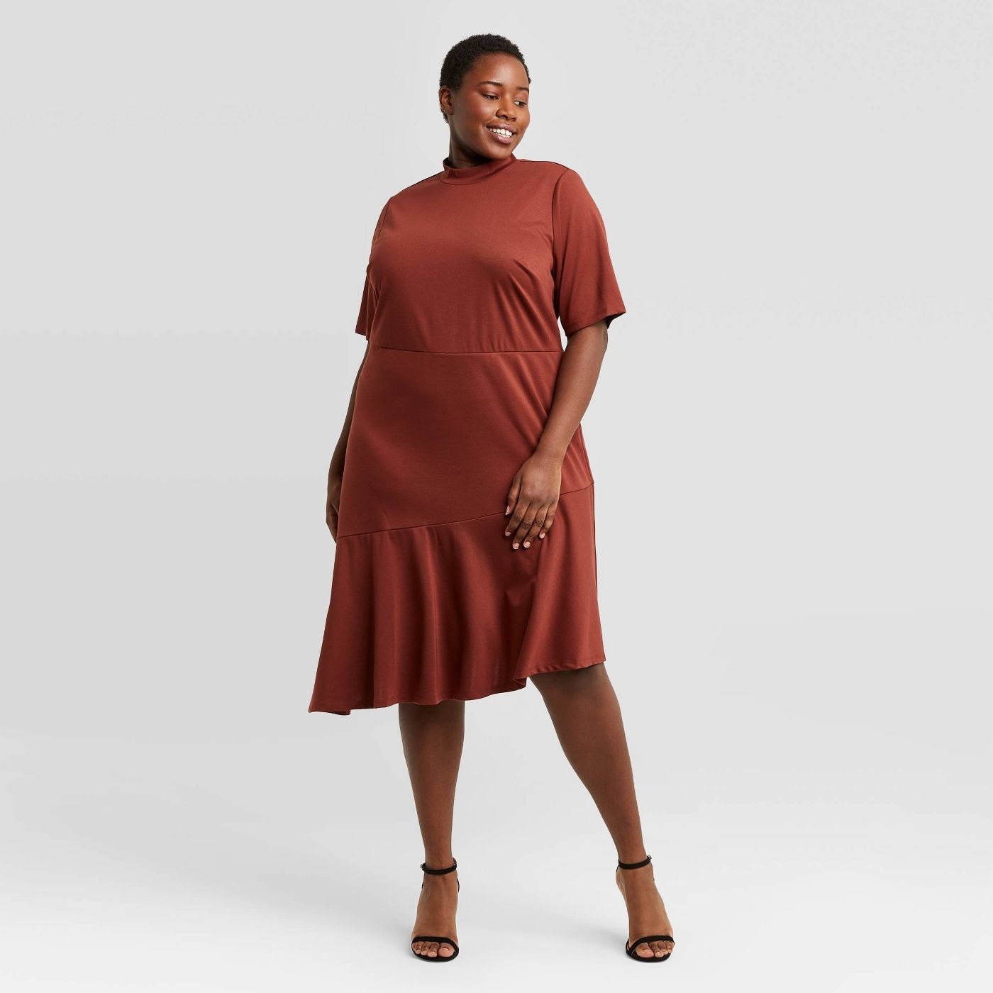 Model wearing the maroon dress