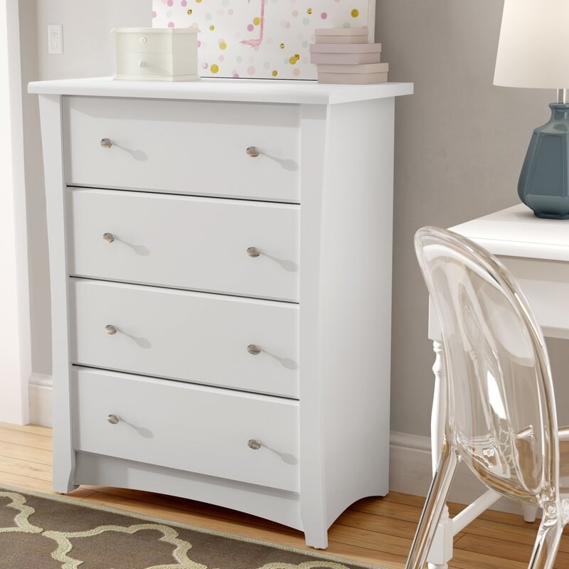 White four drawer dresser with metal handles