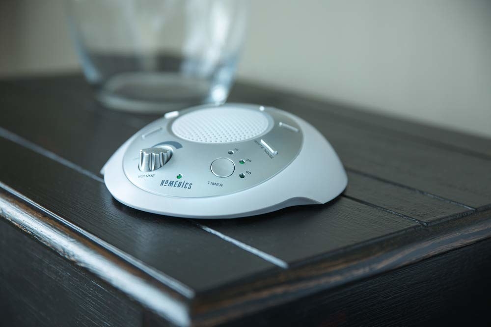 A white noise machine on a table