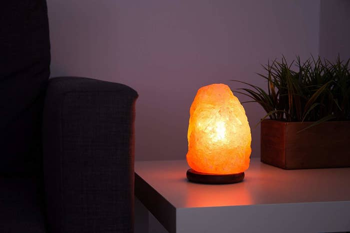 A Himalayan Rock Salt lamp on a desk