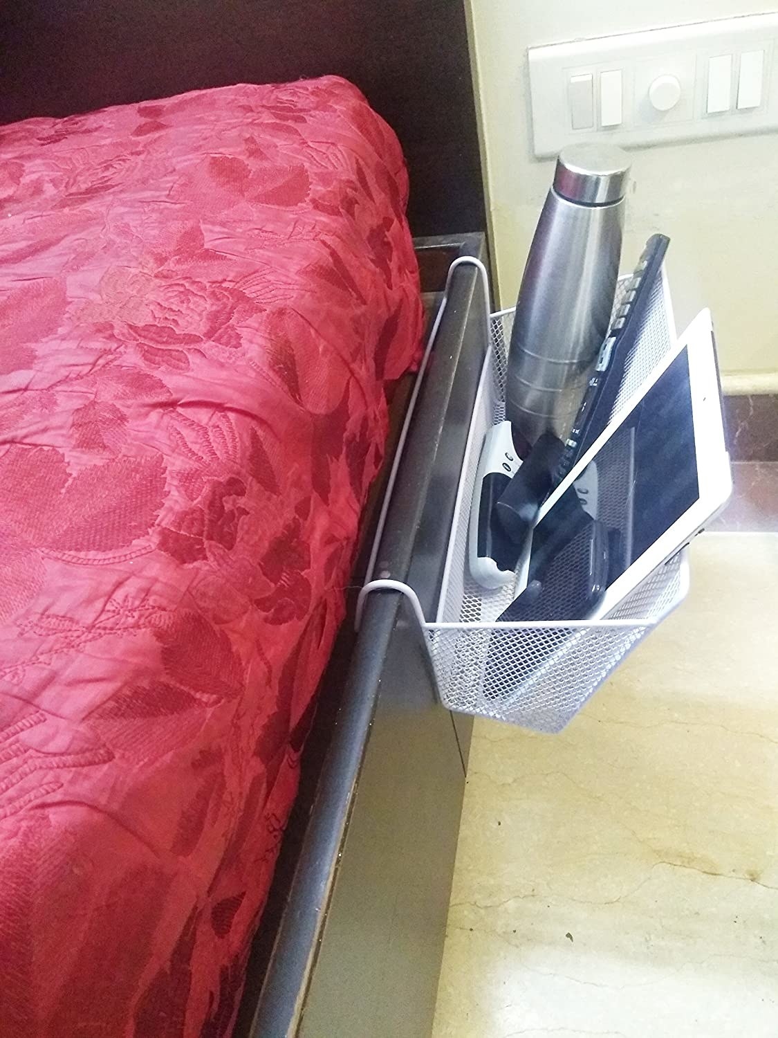 A bedside caddy with things in it