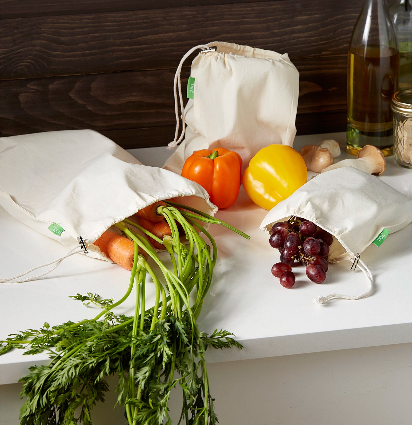 The three produce bags filled with fruits and vegetables