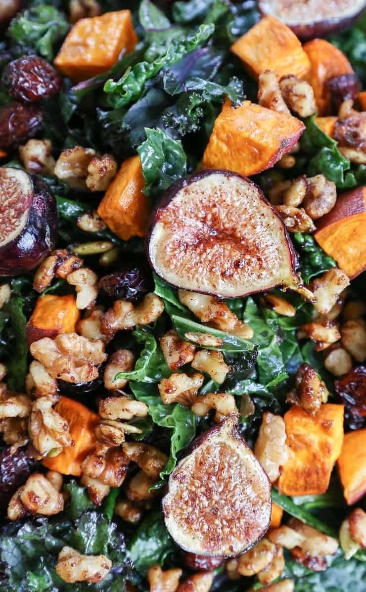 A kale salad with walnuts, figs, and sweet potato.