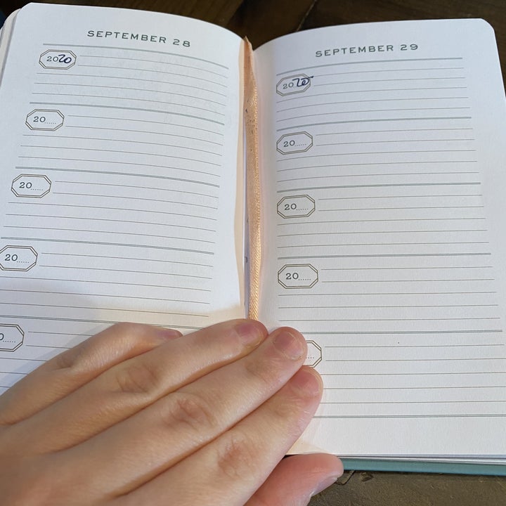 The journal opened to two September date pages, each with five multi-lined sections labeled with "20_" so you can fill in the year