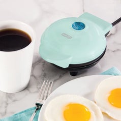 The light blue griddle next to a coffee mug, which it's not much larger in diameter than