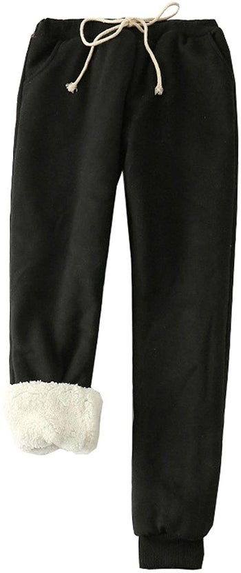the black sweats with white drawstring and white sherpa lining 