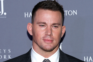 Channing Tatum wearing a dark suit and bright shirt