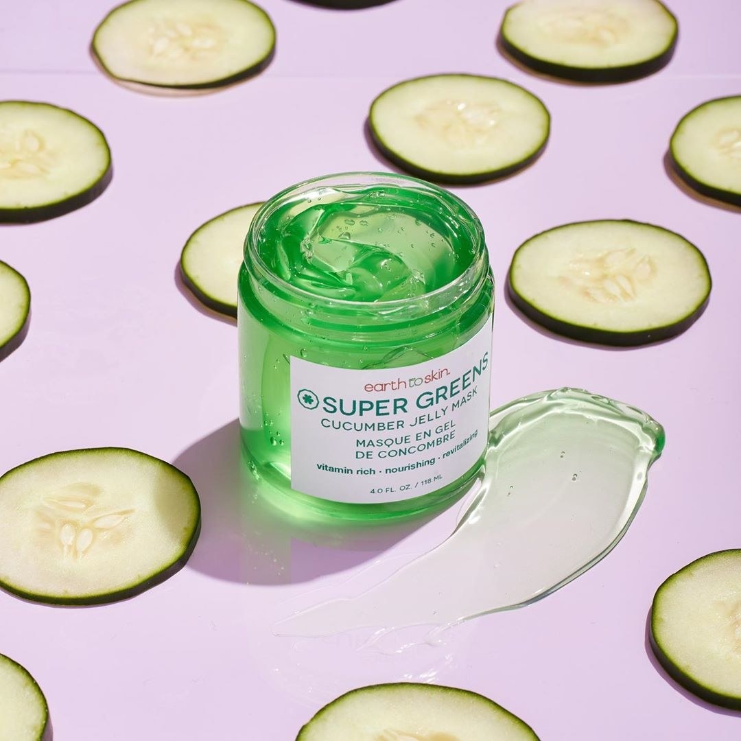 Super Green cucumber jelly mask surrounded by cucumbers