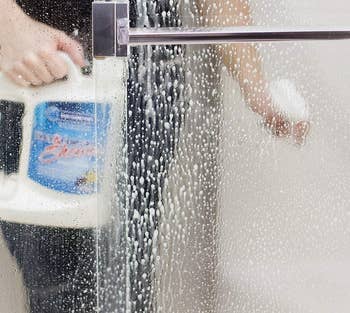 The cleaner being sprayed connected a ablution door