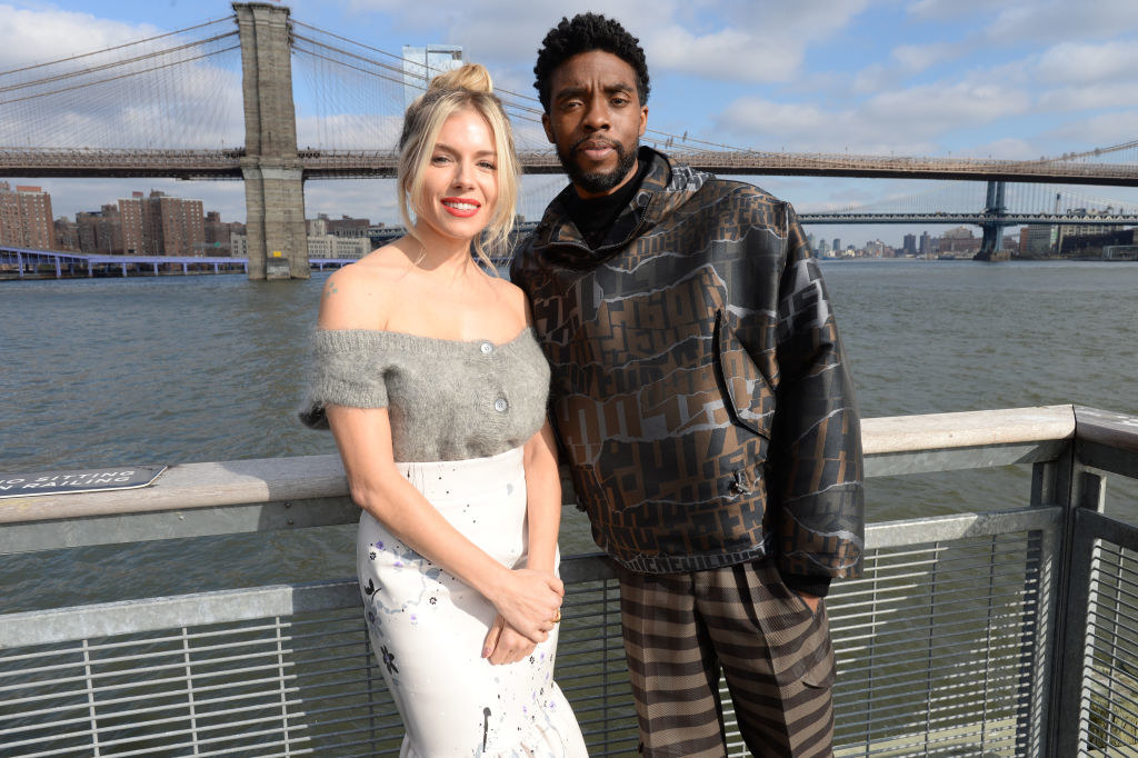 Sienna Miller and Chadwick Boseman pose during a photo call for &quot;21 Bridges&quot;