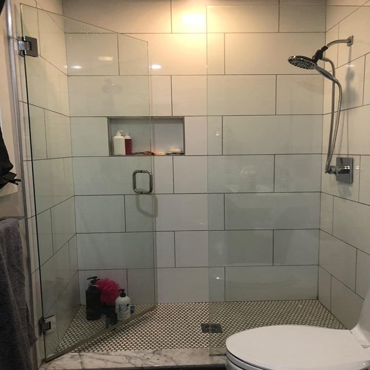 A reviewer's sparkling clean shower with glass doors
