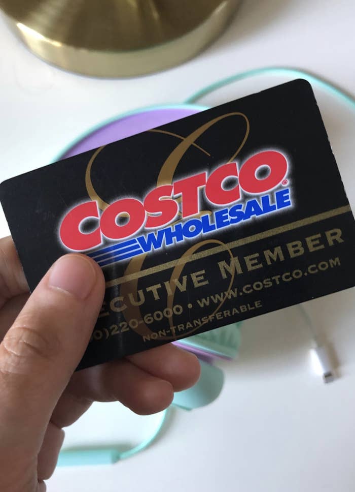 Someone displaying their Costco membership card.