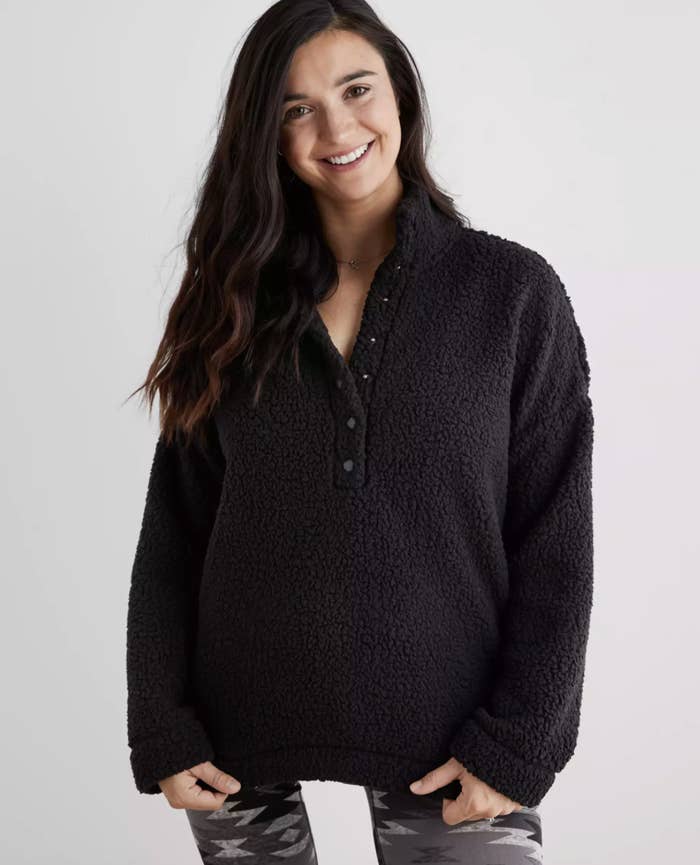 a model in the fuzzy black pullover