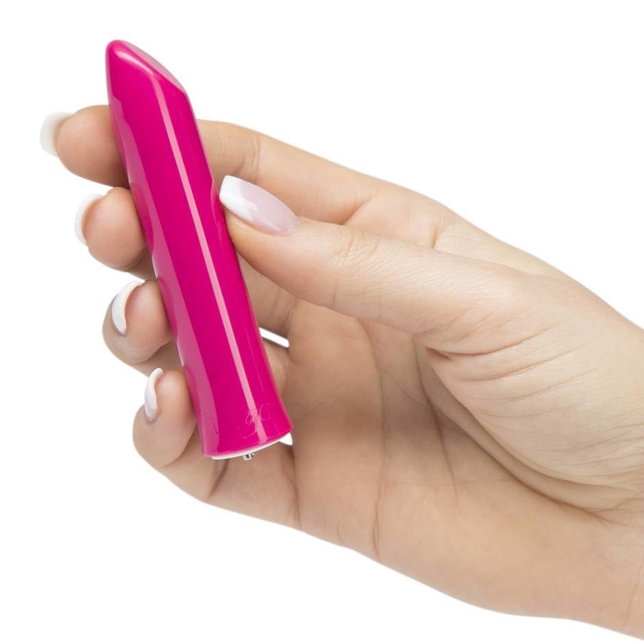 The We-Vibe Tango Lipstick Rechargeable Bullet Vibrator in a model's hand
