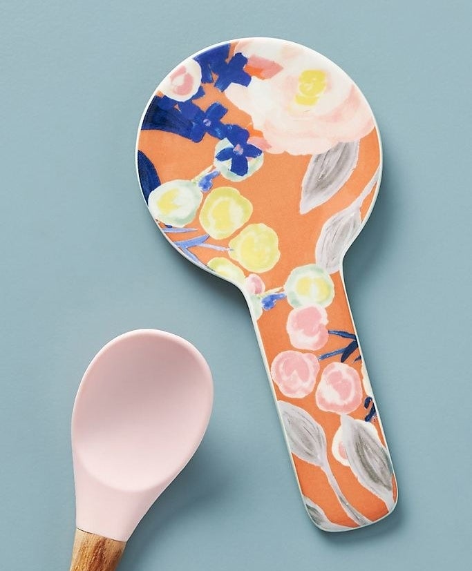 A spoon rest with a pretty and brightly-colored floral design