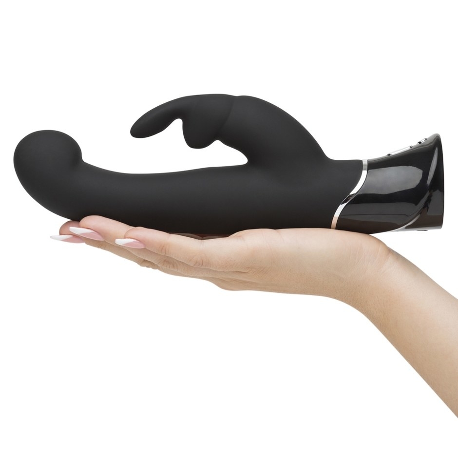 The Fifty Shades of Grey Greedy Girl G Rabbit Vibrator in a model's hand