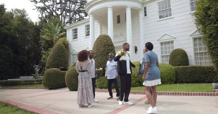 The Banks and Geoffrey outside the iconic Bel-Air mansion from &quot;The Fresh Prince.&quot; 