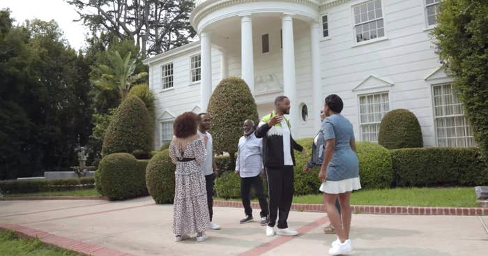 The Banks and Geoffrey outside the iconic Bel-Air mansion from "The Fresh Prince."