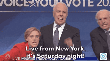 The cast saying &quot;live from new york it&#x27;s saturday night!&quot;